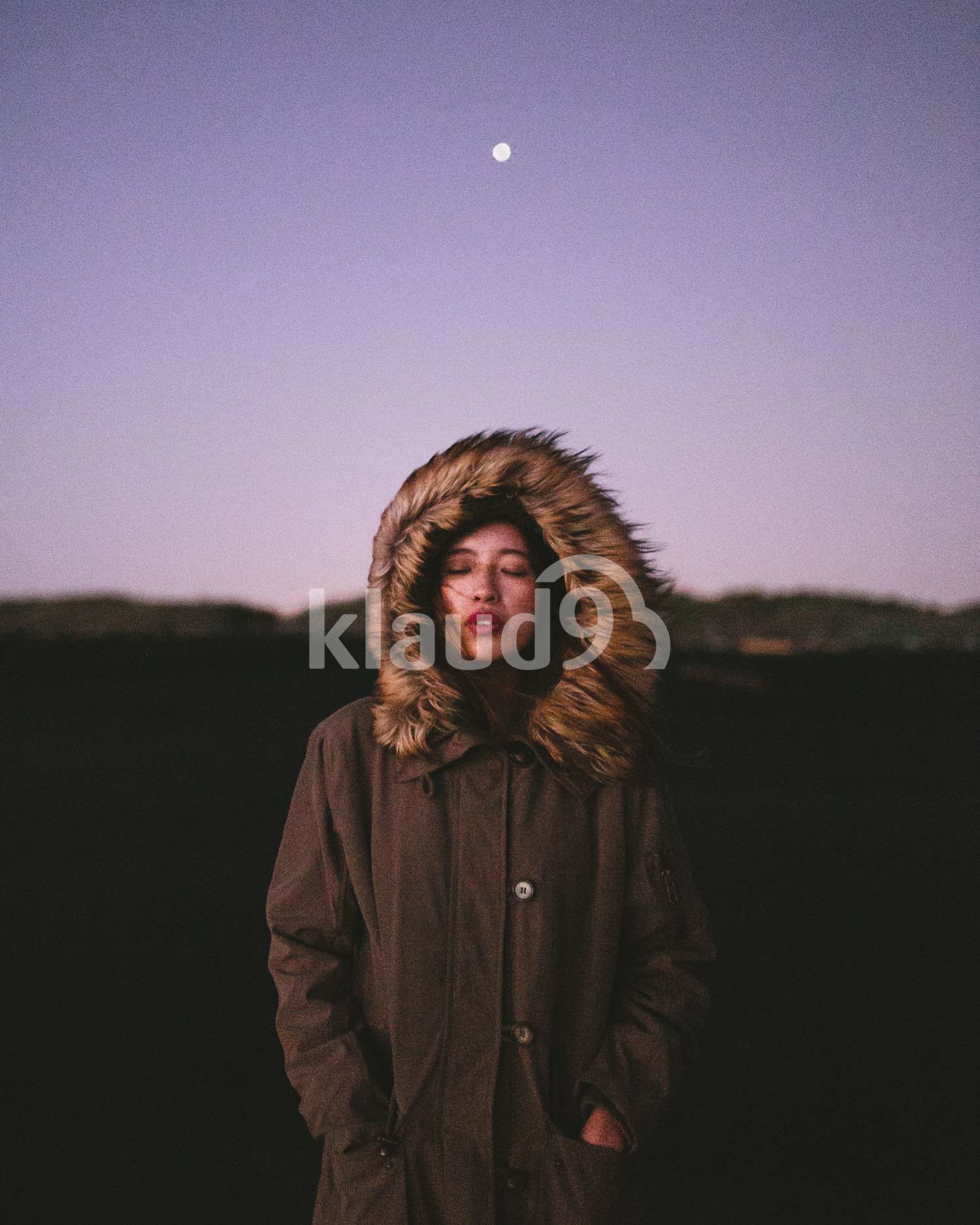 Portrait of young woman at Milford Sound, New Zealand