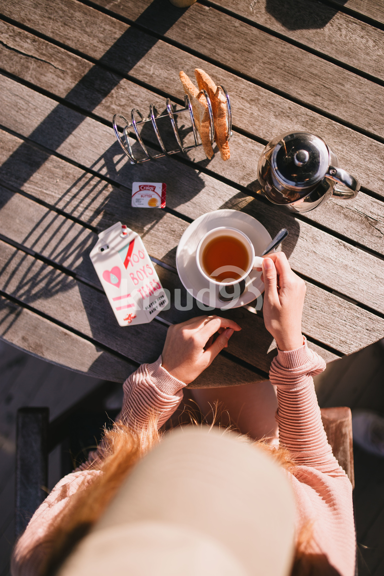 Young hipster woman chilling by the balcony at home in Queenstown, New Zealand