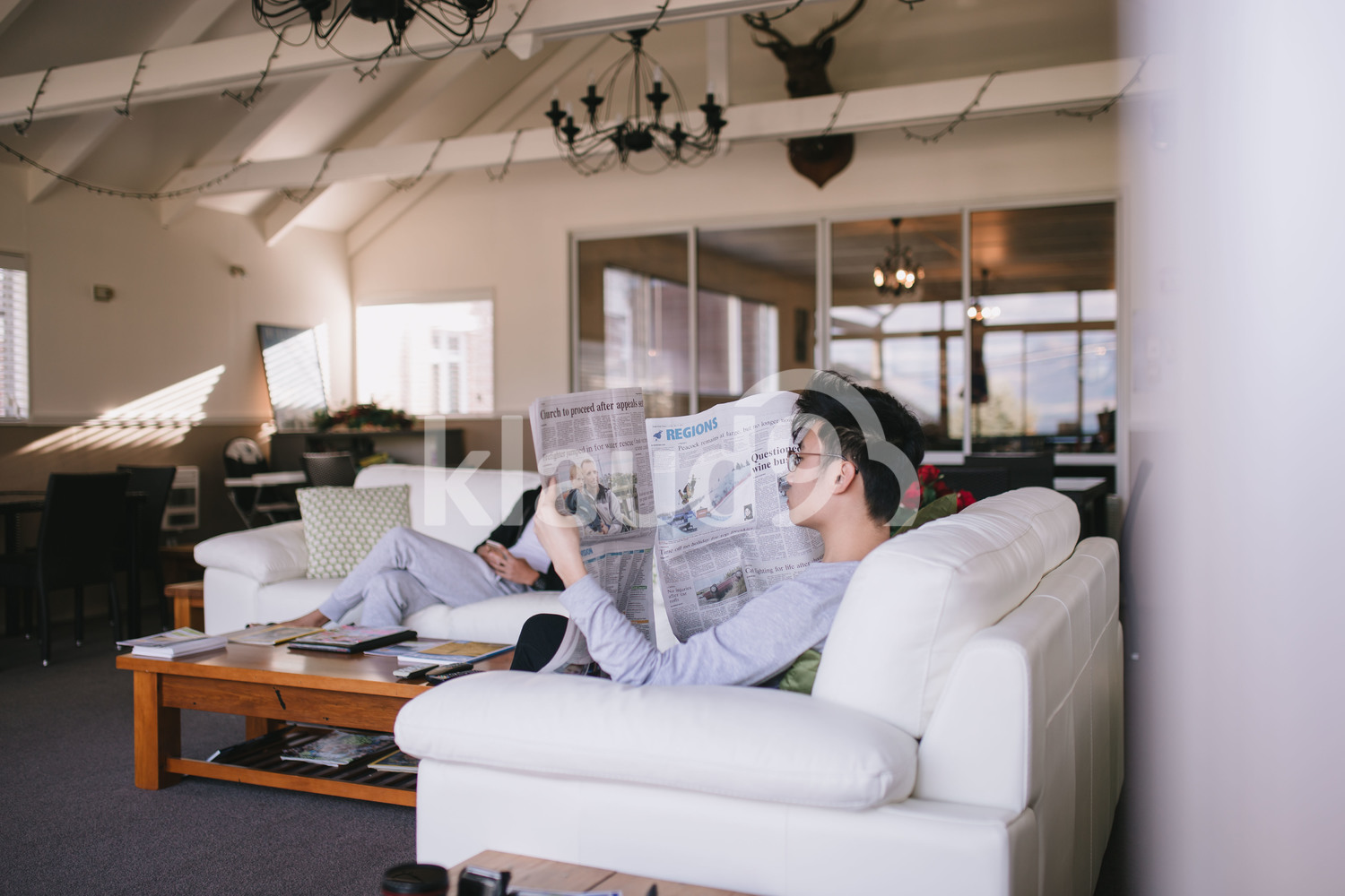 Friends relaxing in the living room in Queenstown, New Zealand