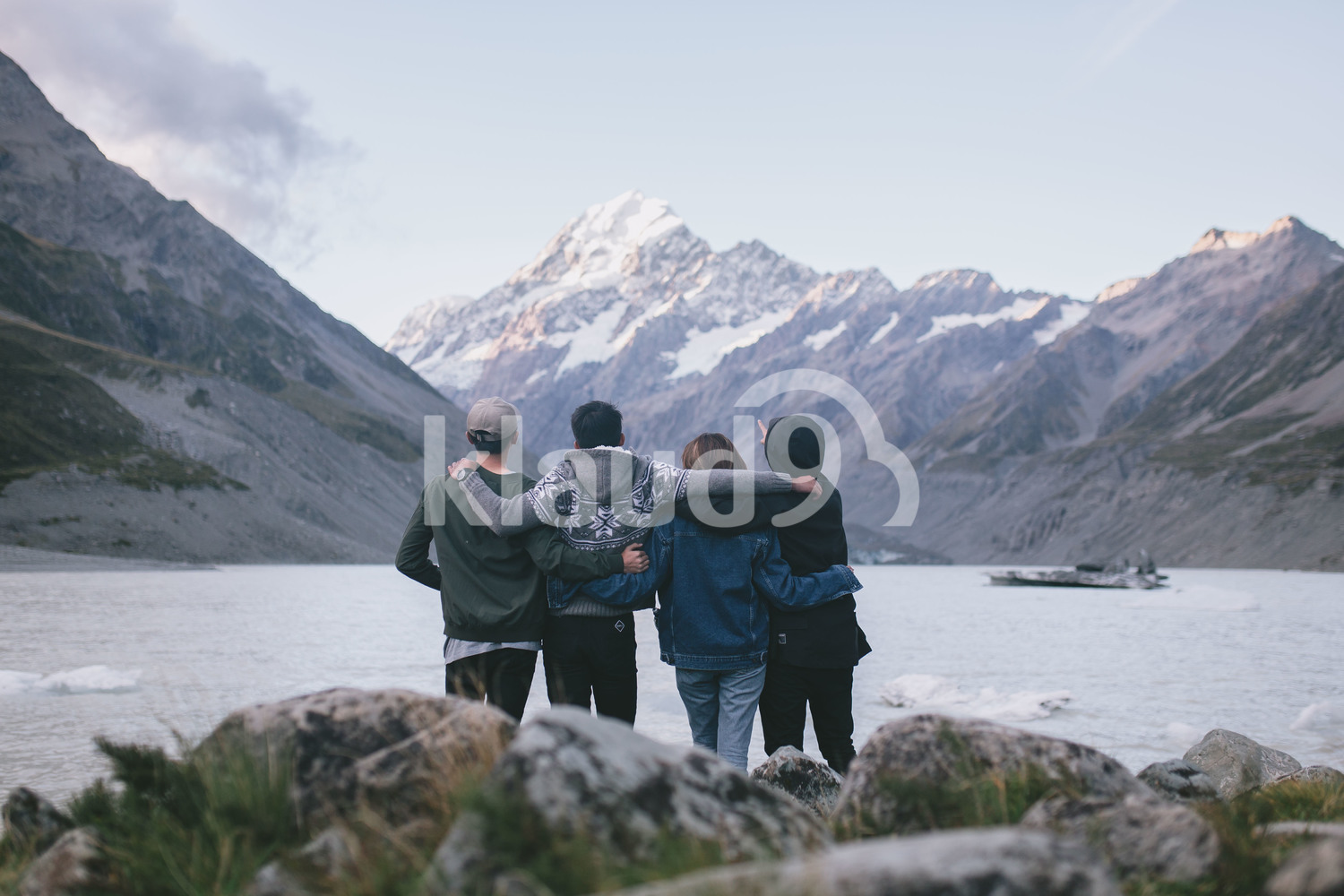 Group of friends enjoying the view at Milford Sound, New Zealand