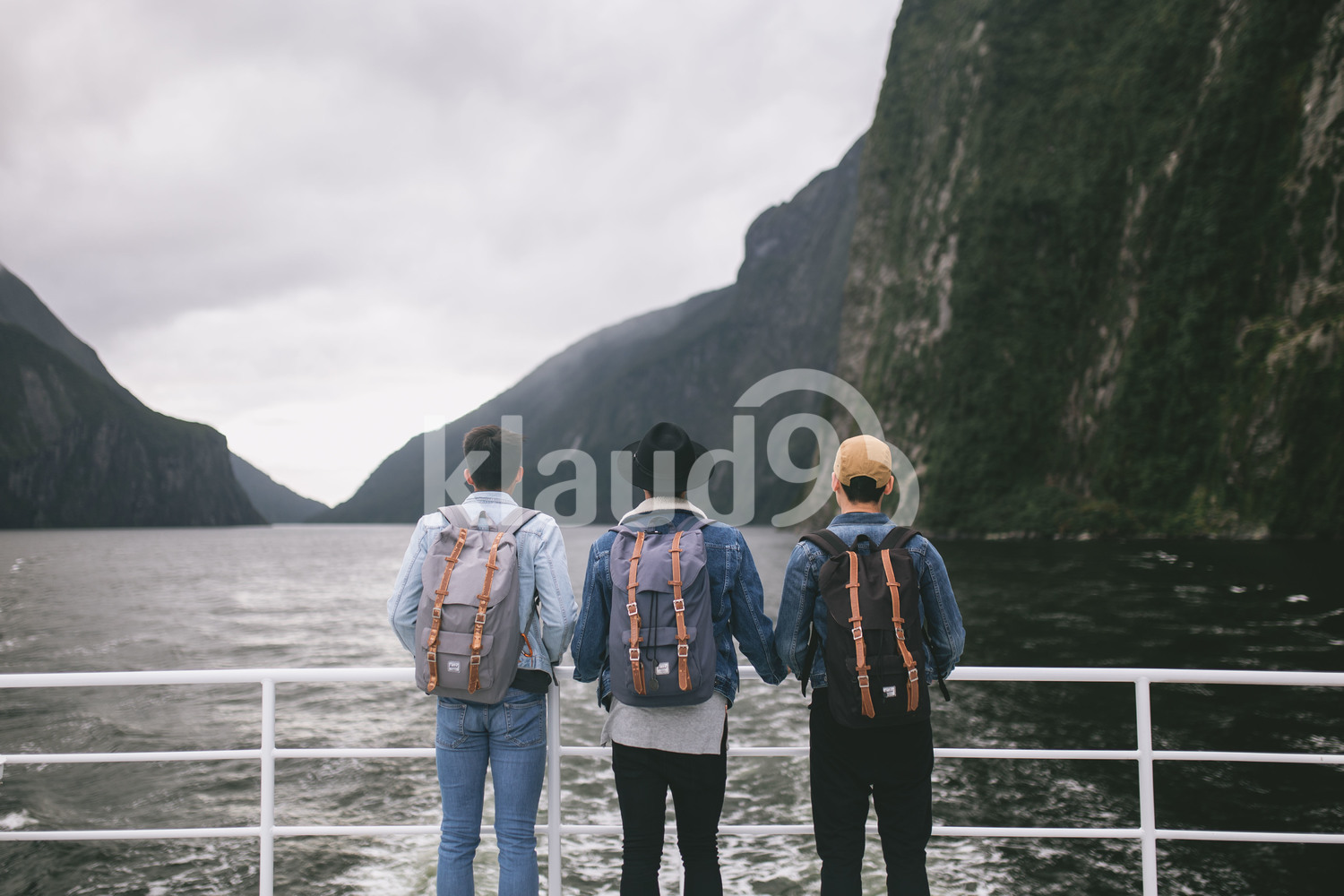 Back view of three young men checking out the view in New Zealand