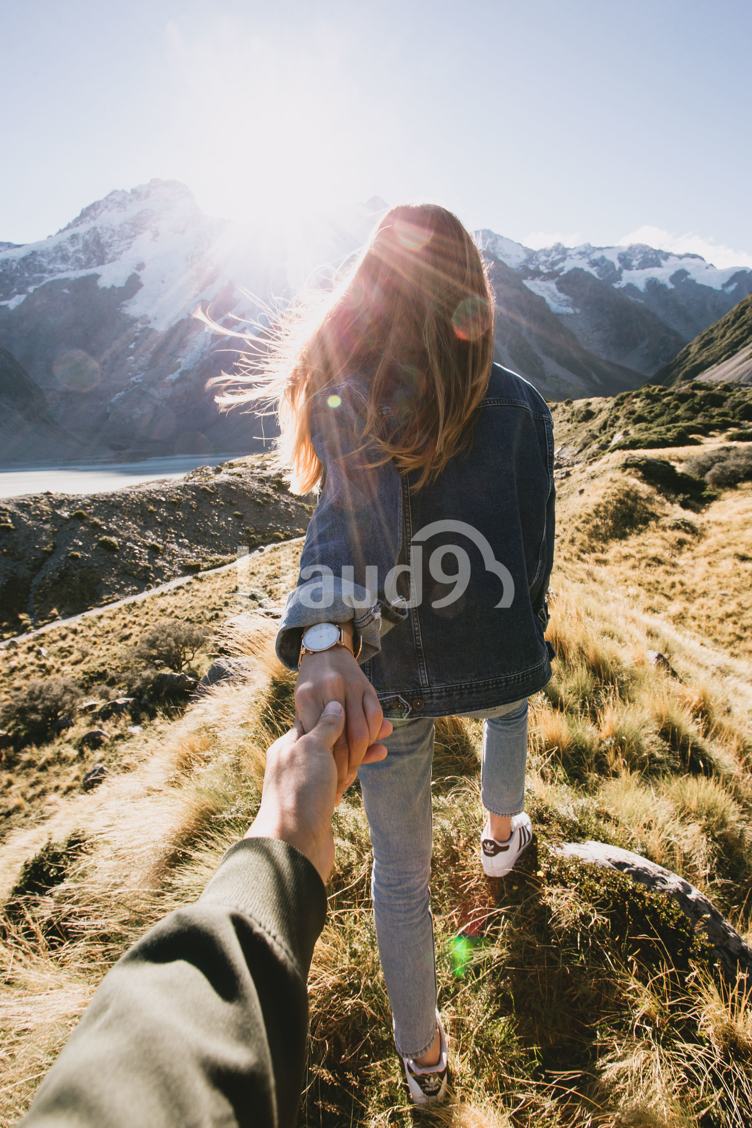 Back view of a couple on Mountain Cook National Park, New Zealand