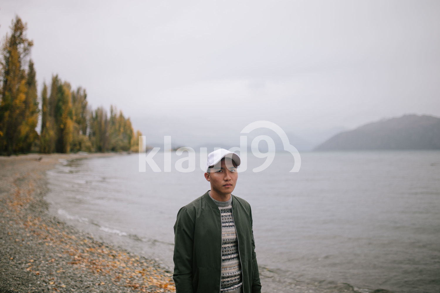 Young man exploring Milford Sound, New Zealand