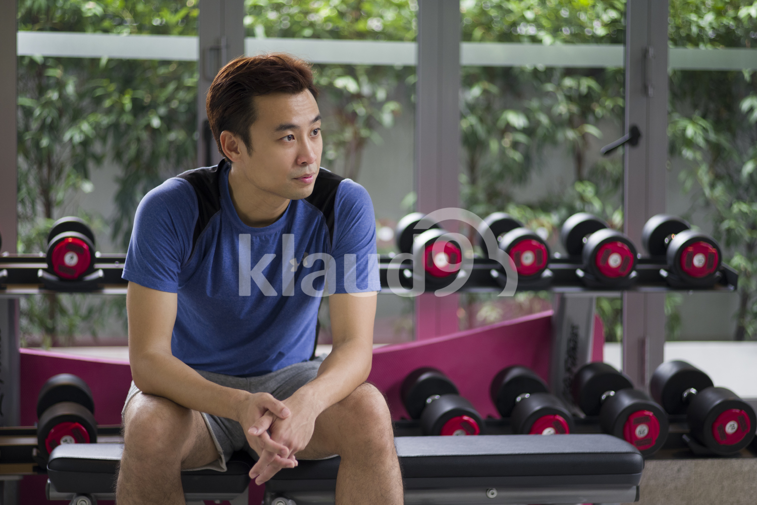 Young man taking a quick break between workouts