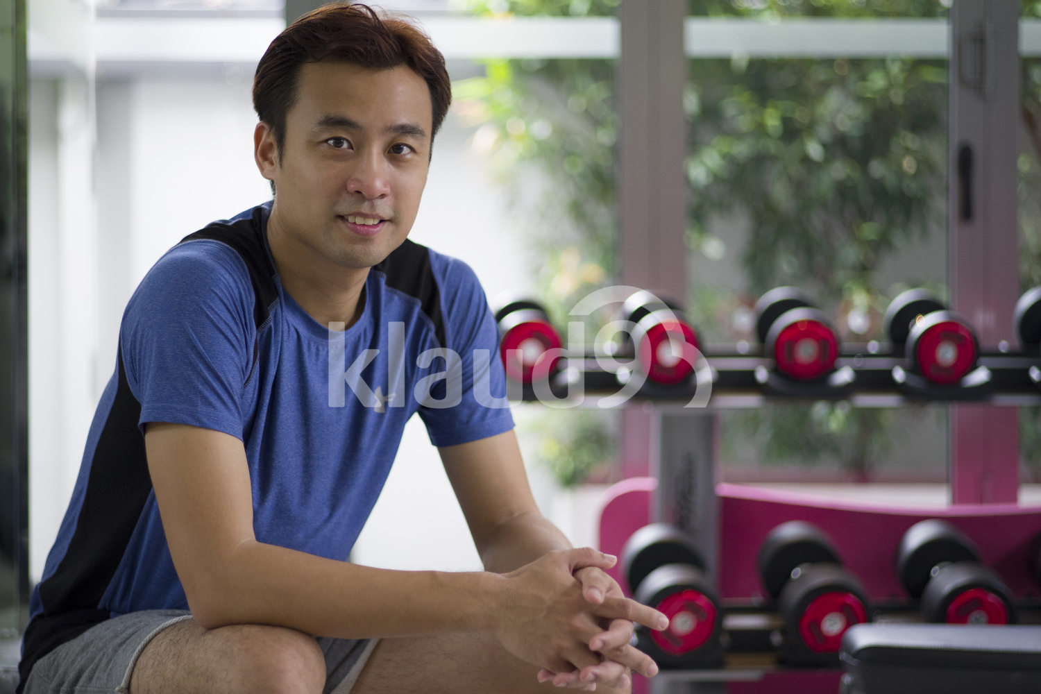 Portrait of young man taking a quick break between workouts.