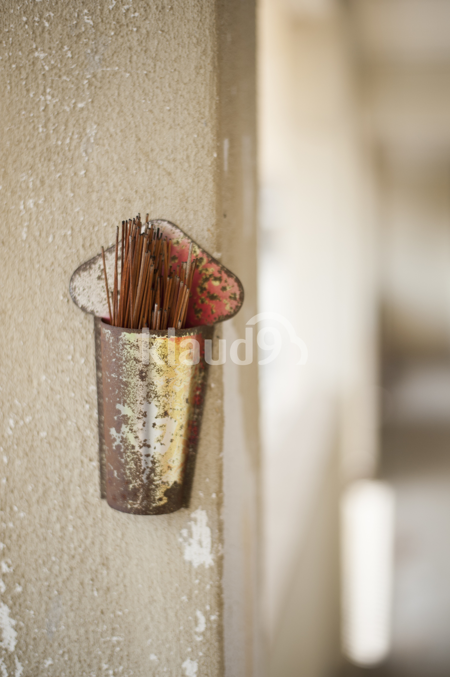 Weathered incense holder.