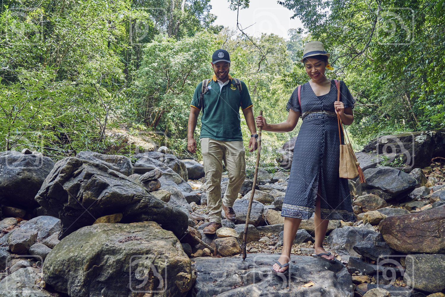 Young couple exploring Klong Plu Waterfalls in Koh Chang, Thailand 