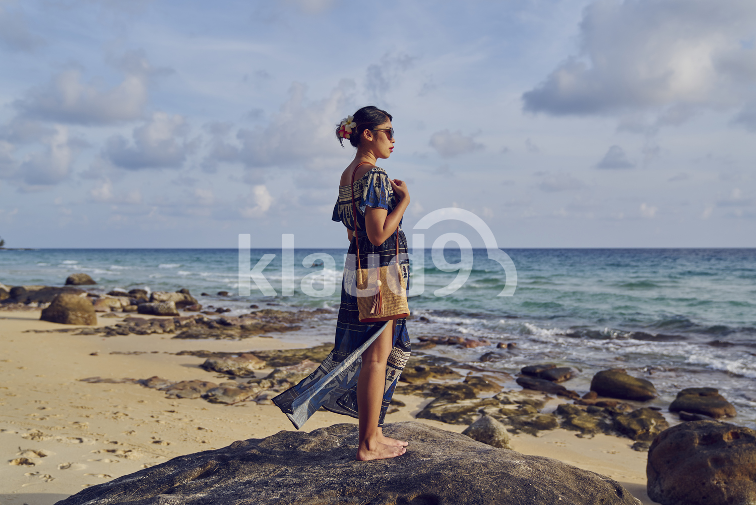 Young woman walking by the beach in Koh Kood, Thailand