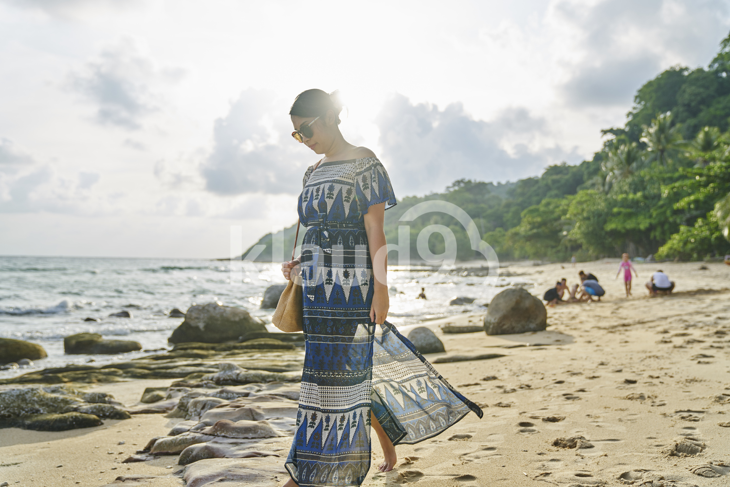 Young woman walking by the beach in Koh Kood, Thailand