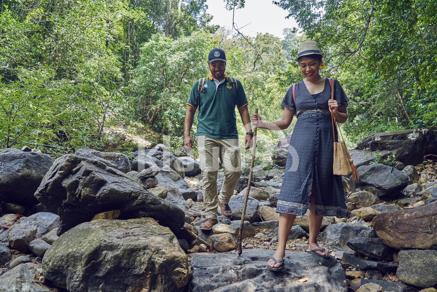Young couple exploring Klong Plu Waterfalls in Koh Chang, Thailand