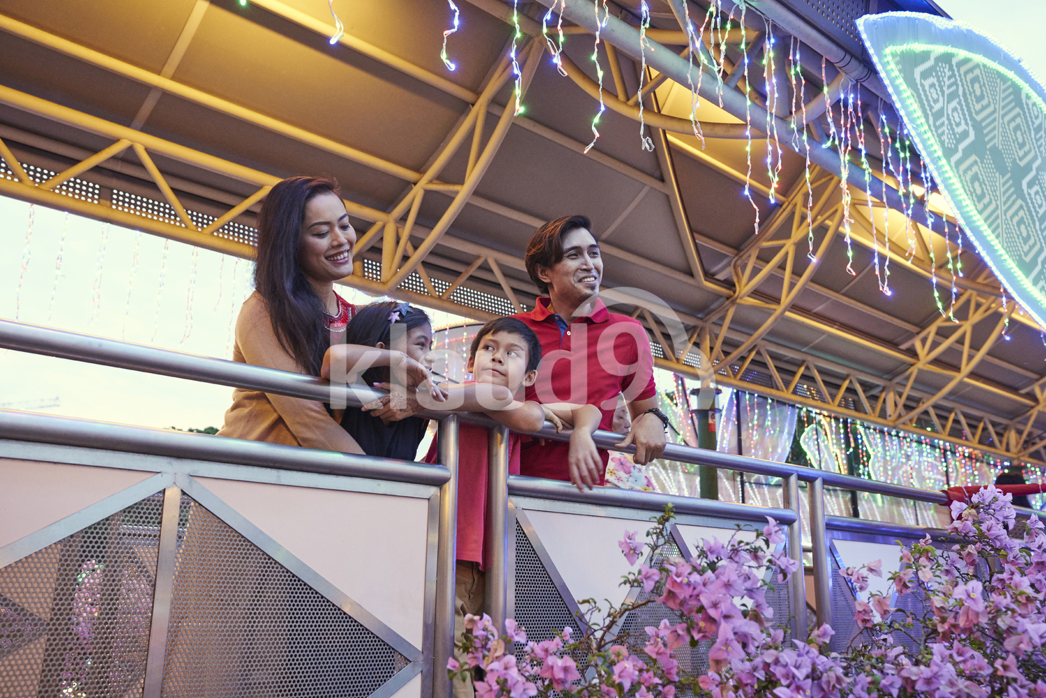 Happy family checking out the light up at Geylang Hari Raya Bazaar, Singapore