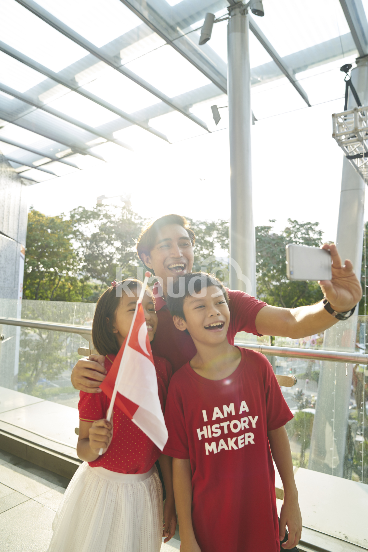 Happy family celebrating Singapore's National Day