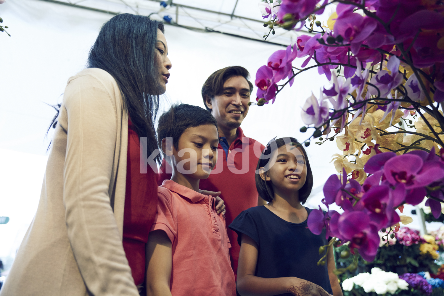 Family shopping for flowers during Hari Raya Bazaar at Geylang, Singapore