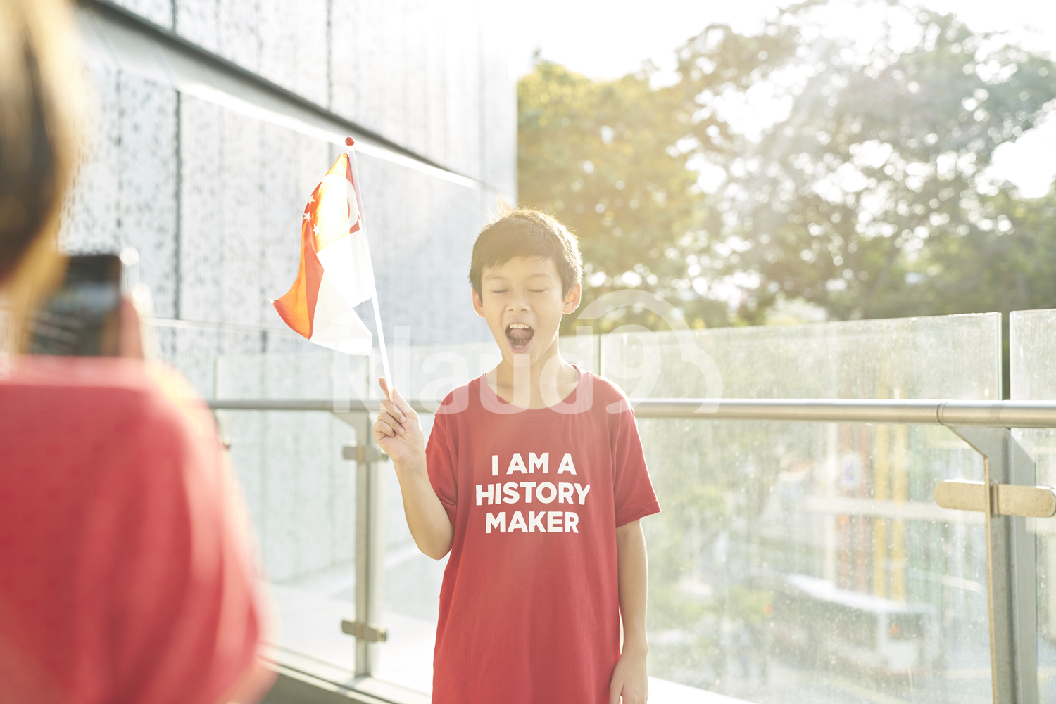 Siblings celebrating Singapore's National Day