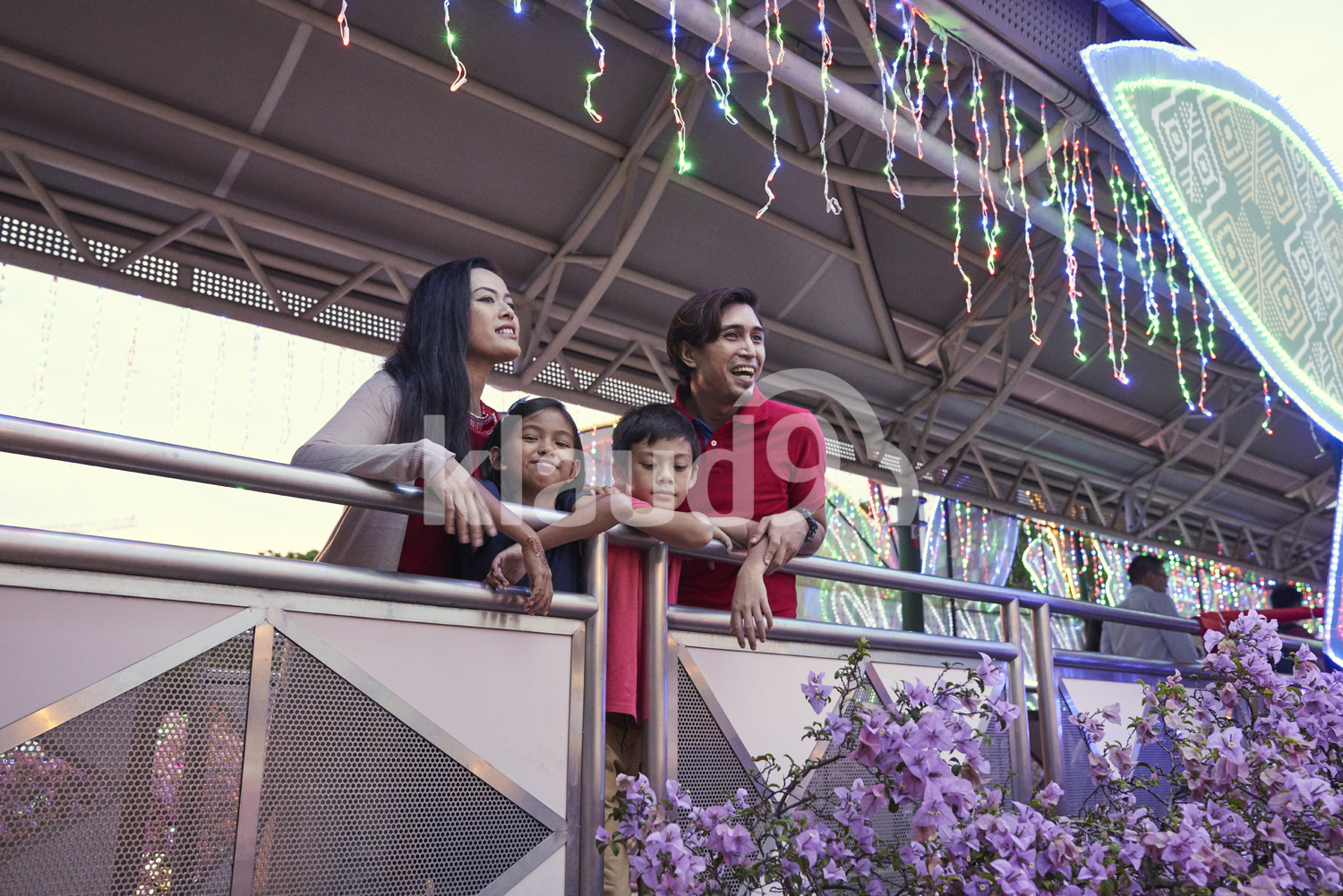 Happy family checking out the light up at Geylang Hari Raya Bazaar, Singapore