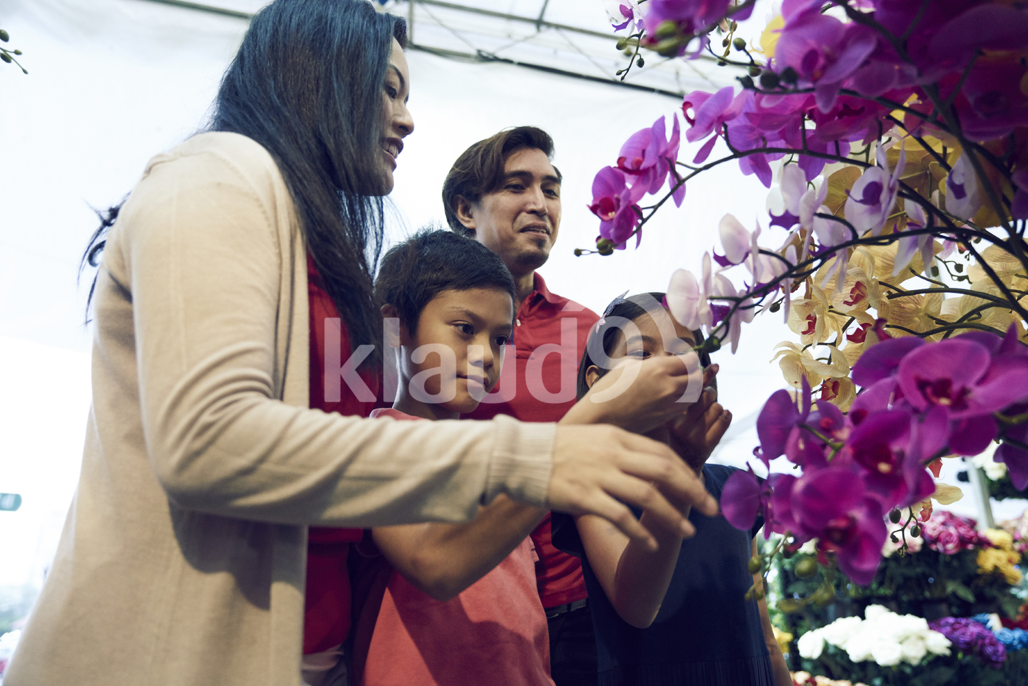 Family shopping for flowers during Hari Raya Bazaar at Geylang, Singapore