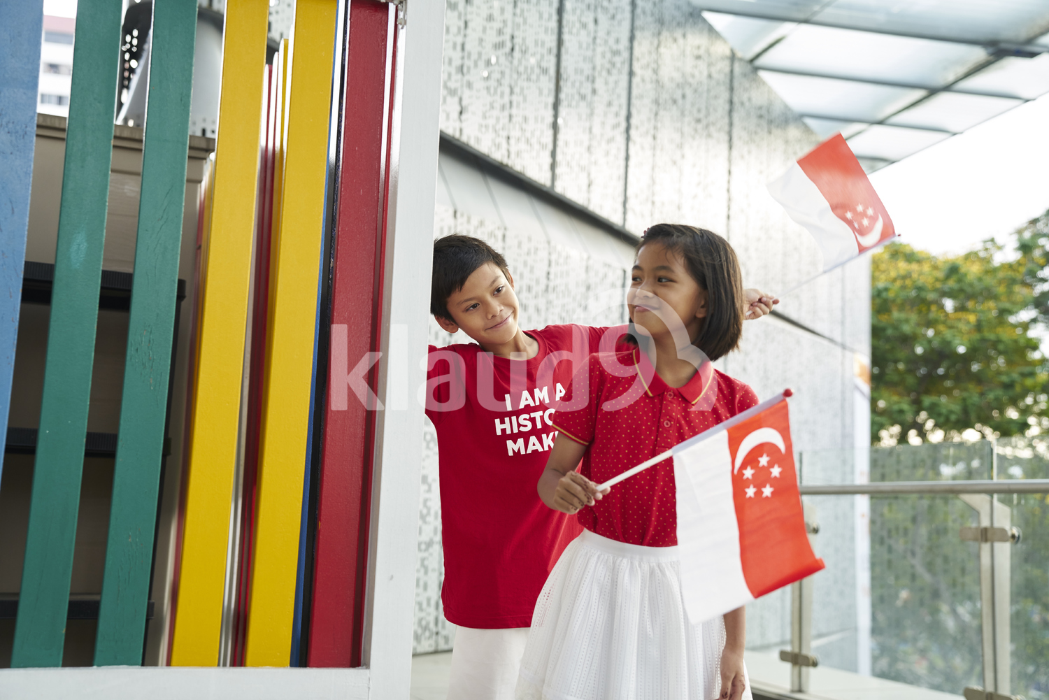 Adorable siblings celebrating Singapore's National Day