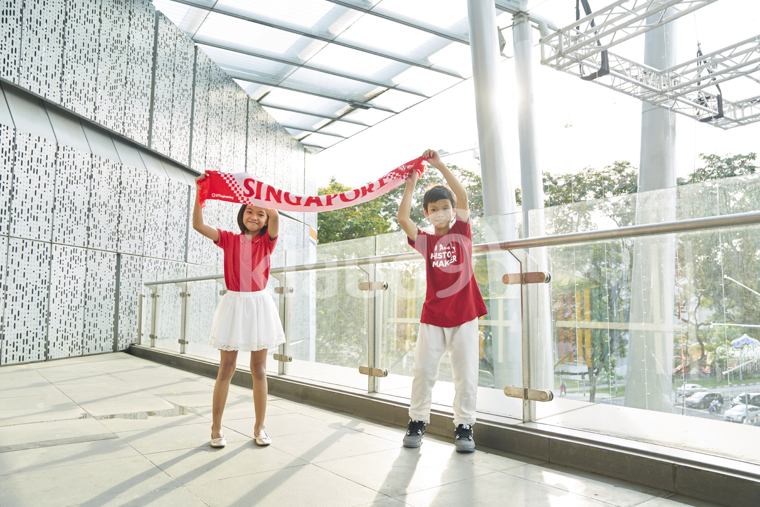 Siblings celebrating Singapore's National Day