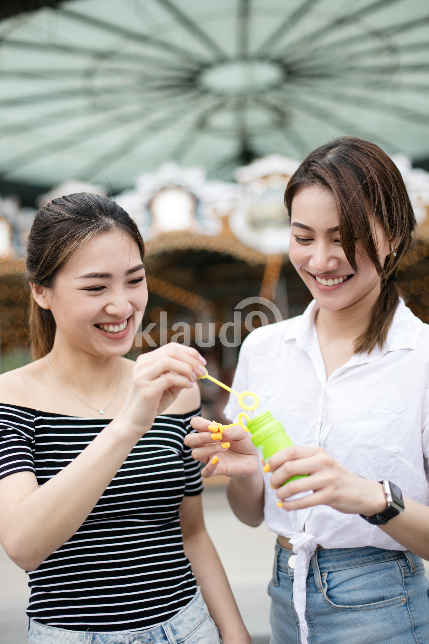 Young women blowing soap bubbles