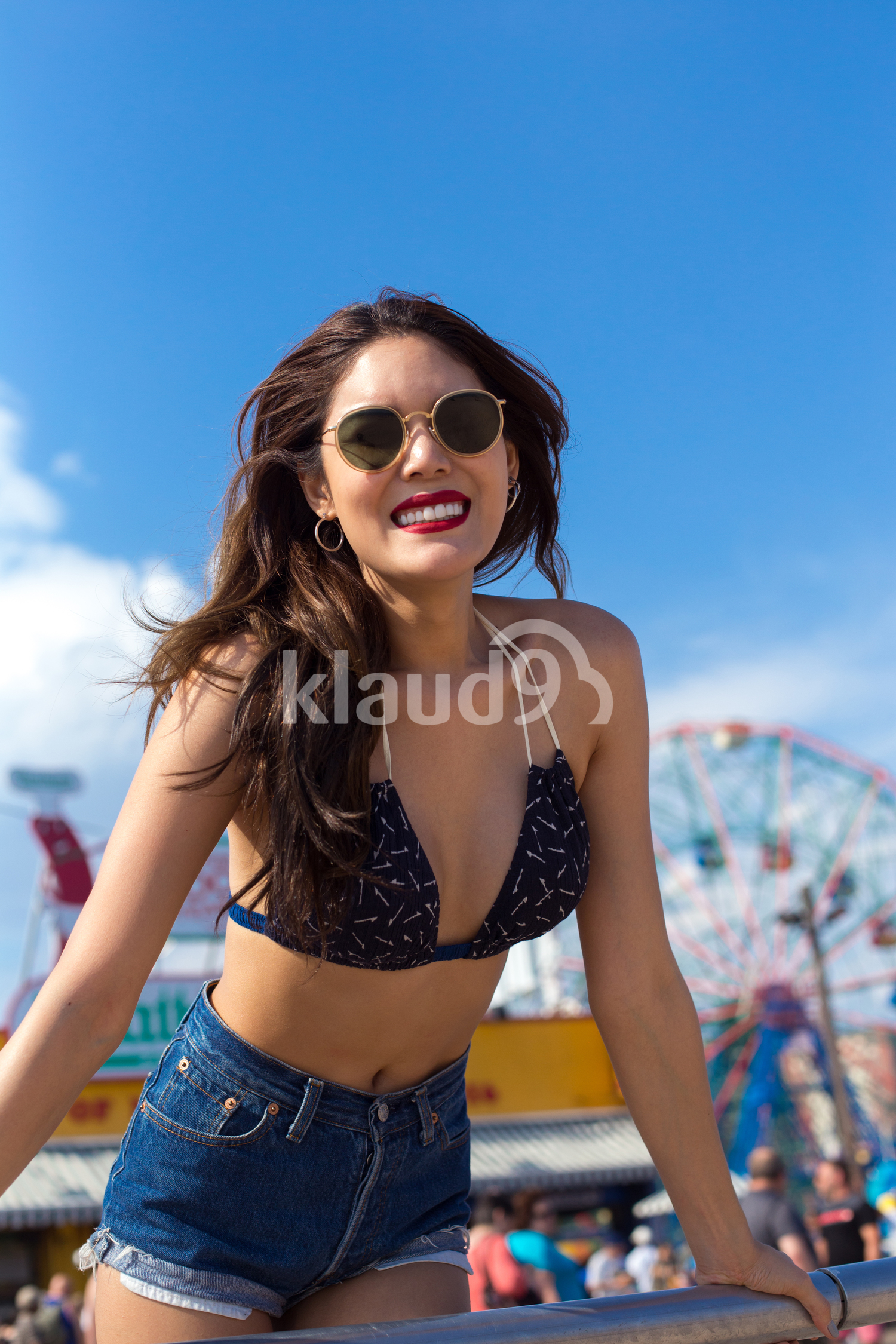 Smiling to the sun on the beach in summertime 