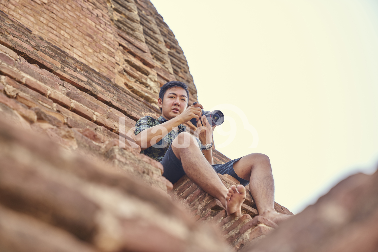 Young Man Taking Photos Around Of The Ancient Temple, Pagoda, Bagan, Myanmar