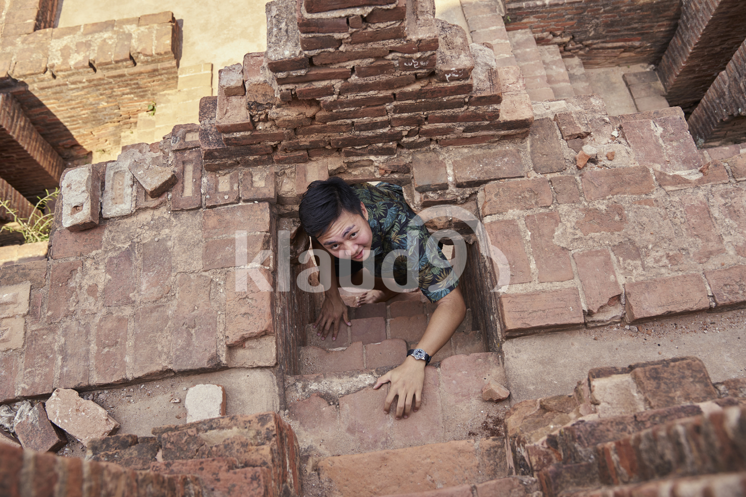 Young Man Crawling Up The Stairs Of The Ancient Temple, Pagoda, Bagan, Myanmar