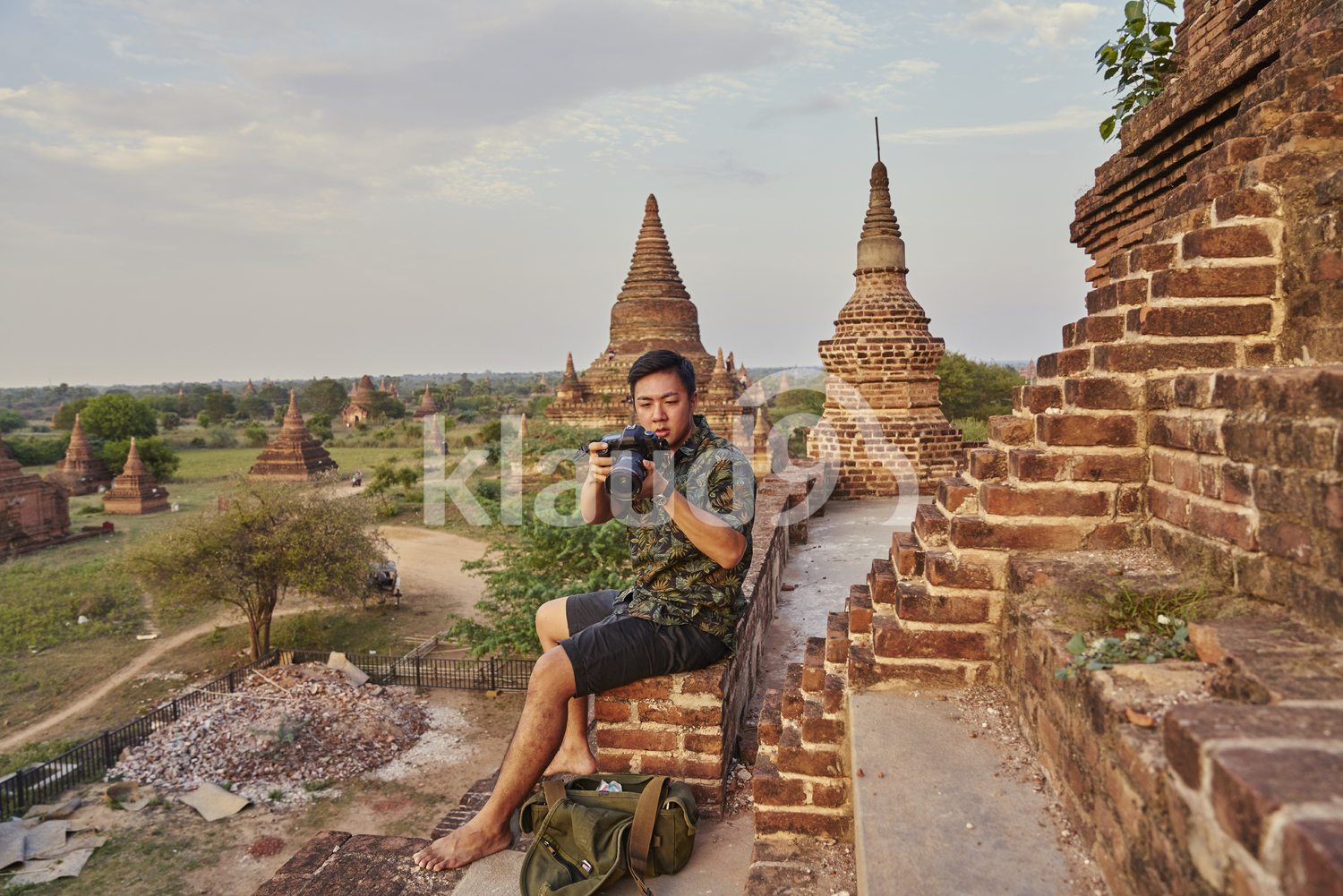 Young Man Taking Photos Around The Ancient Pyathadar Temple, Bagan, Myanmar