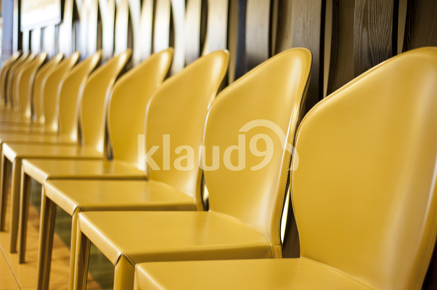 Yellow chairs in a row.