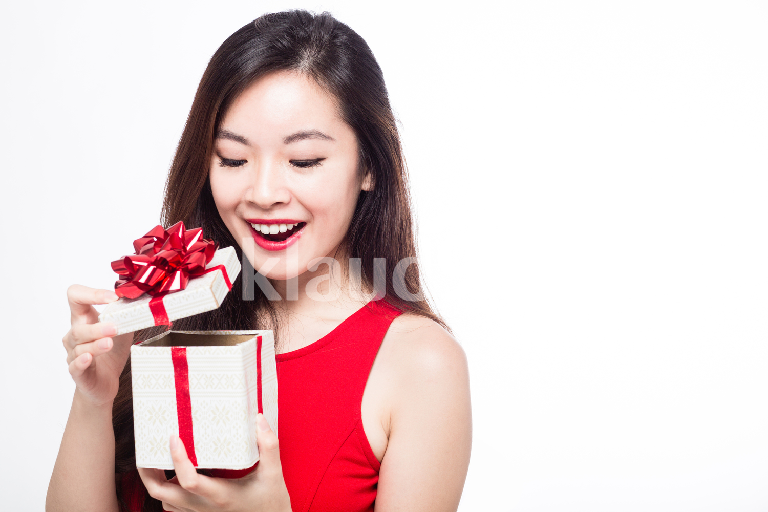 Pan Asian woman opening her gift box