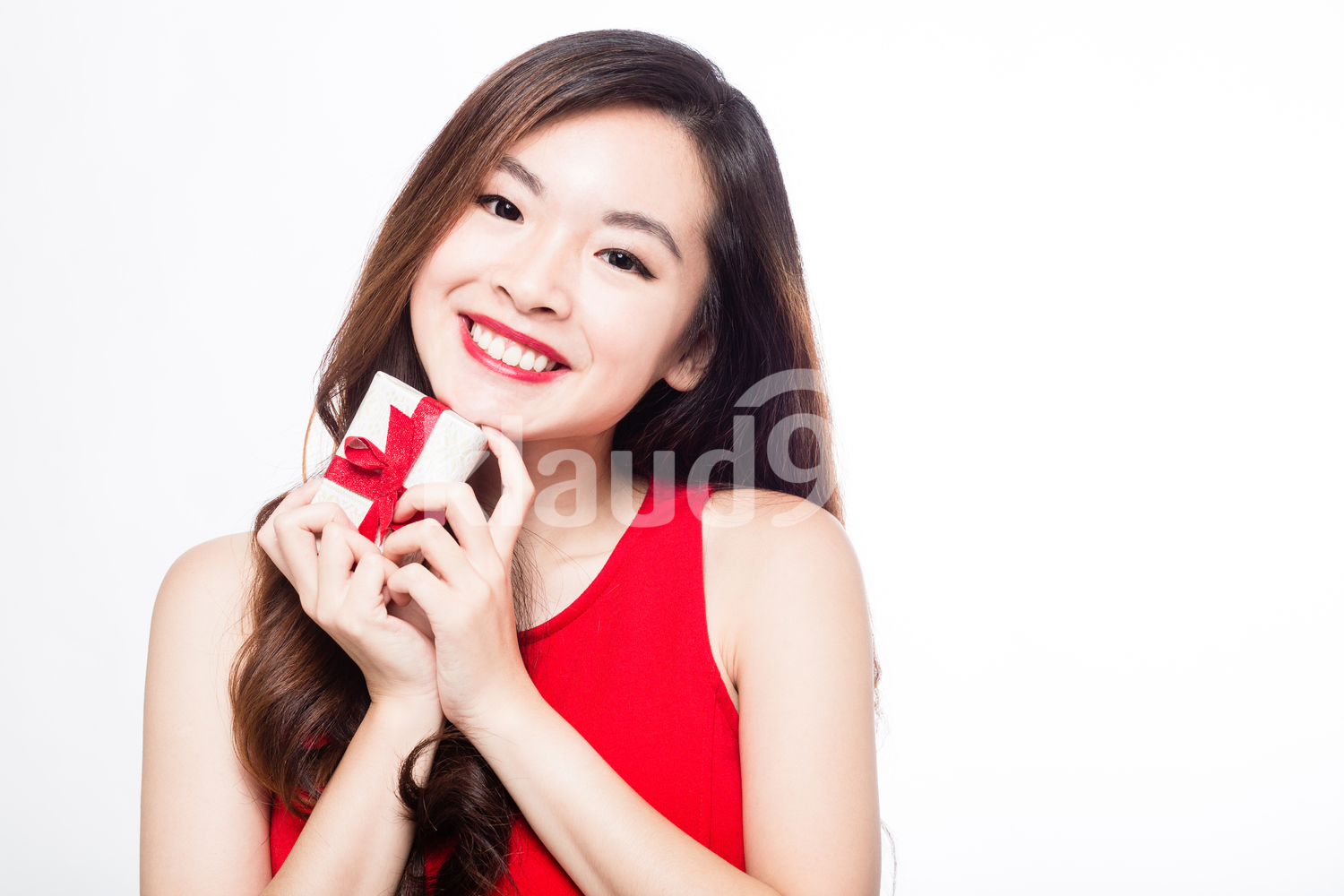 Pan Asian woman with a small gift box