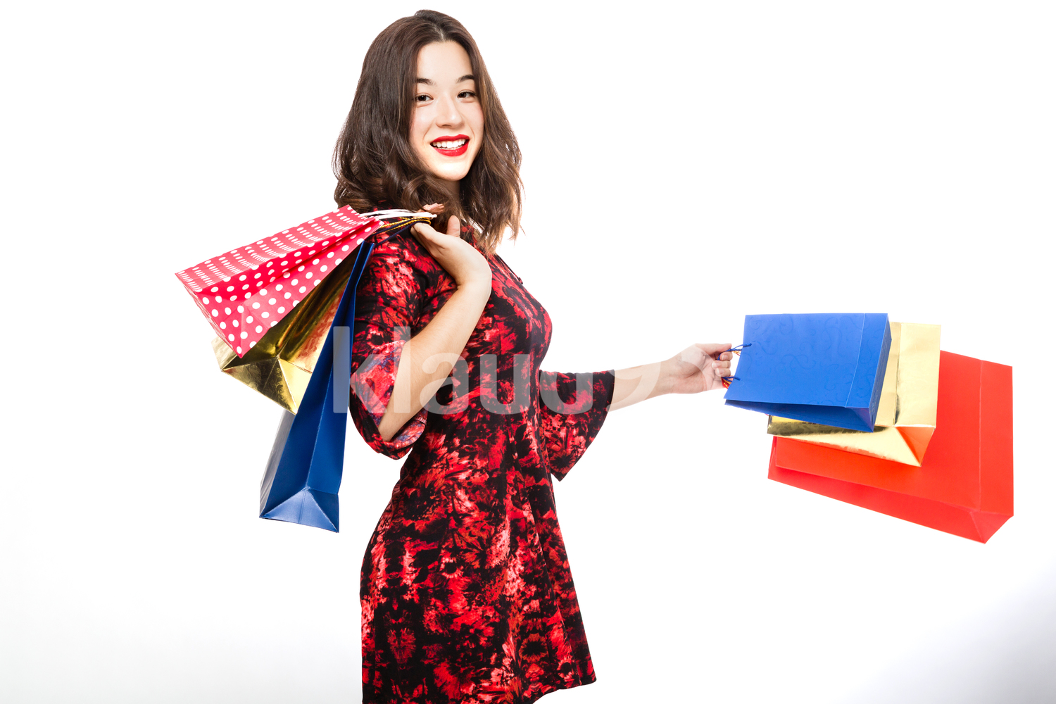 Pretty Woman Happily Smiling with her Shopping Bags
