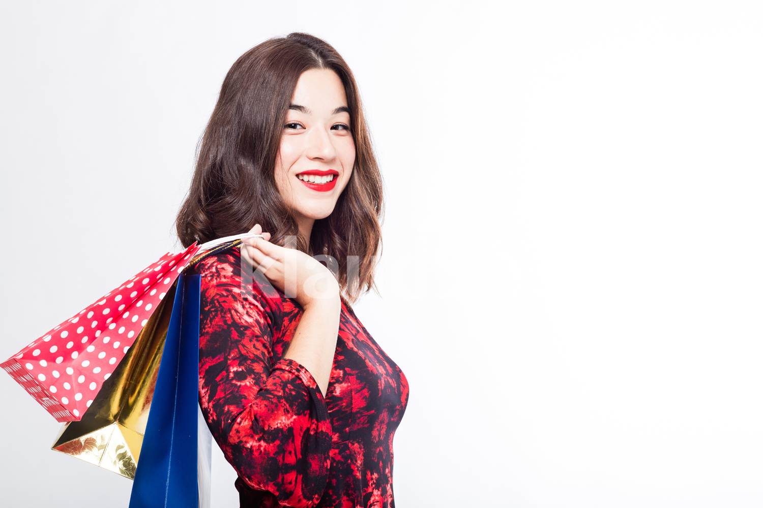 Pretty Eurasian Woman with Her Shopping Bags