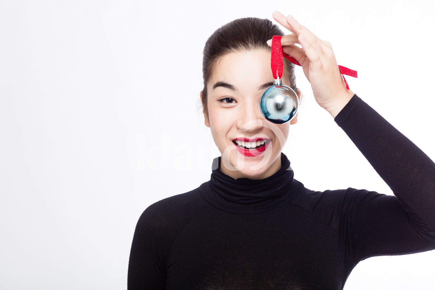 Eurasian Woman with her Christmas Ball Ornament