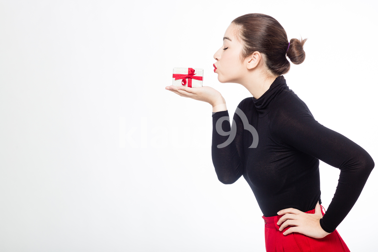 Eurasian Woman with her Small Christmas Gift