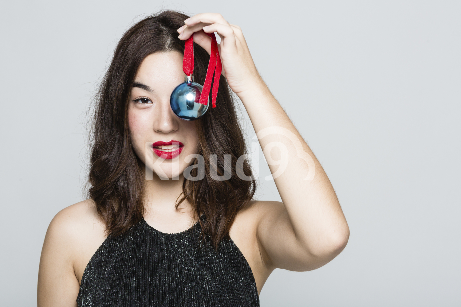 Pretty Woman with a Christmas Ball Ornament
