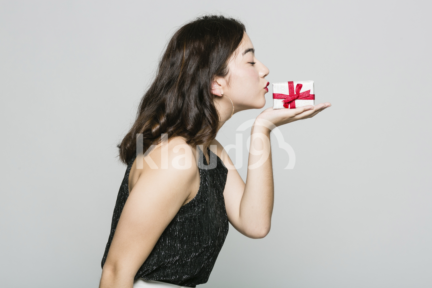 Long Hair Woman with a Small Gift Box