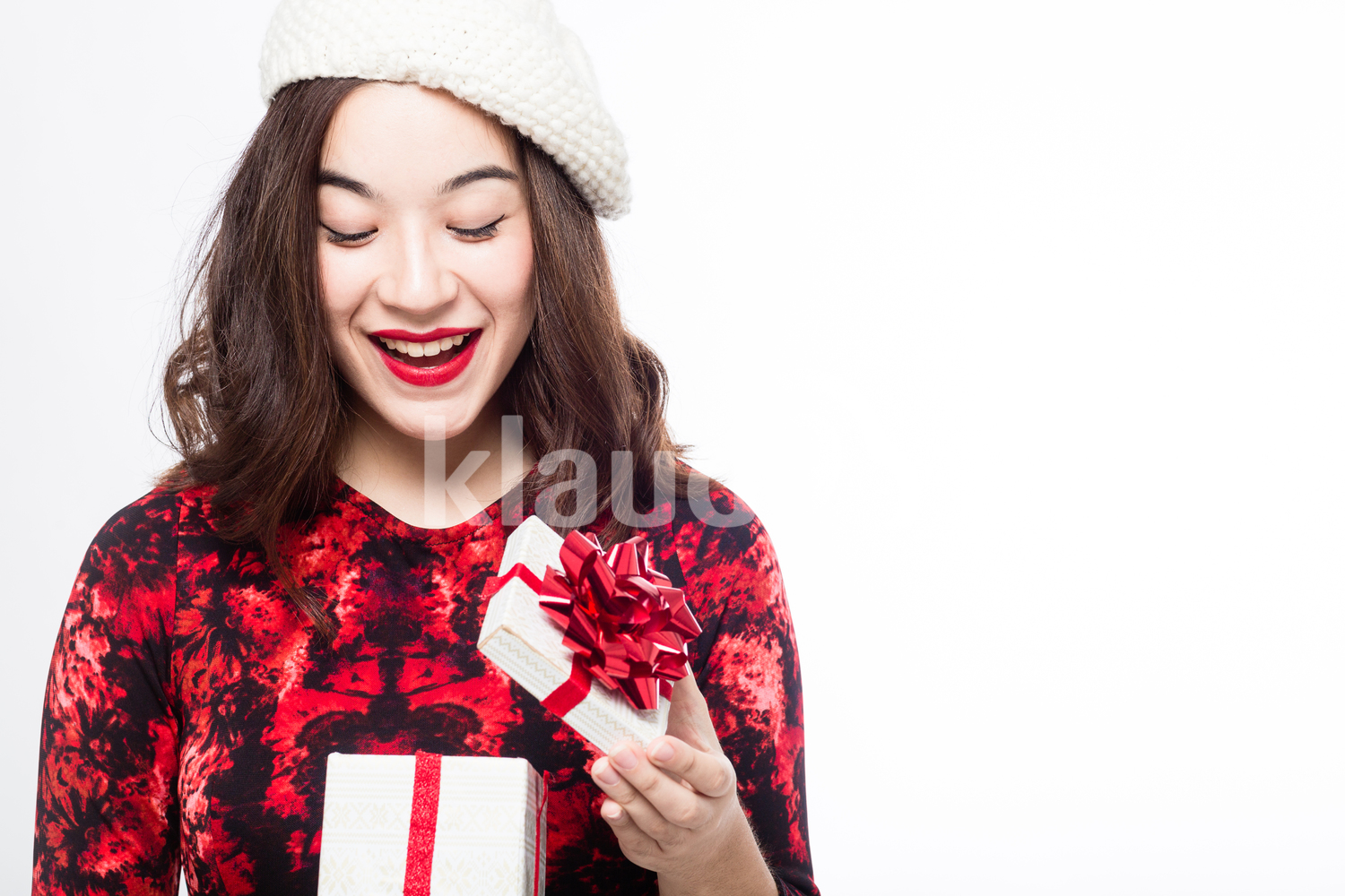 Pretty Eurasian Woman Opening Her Gift Box