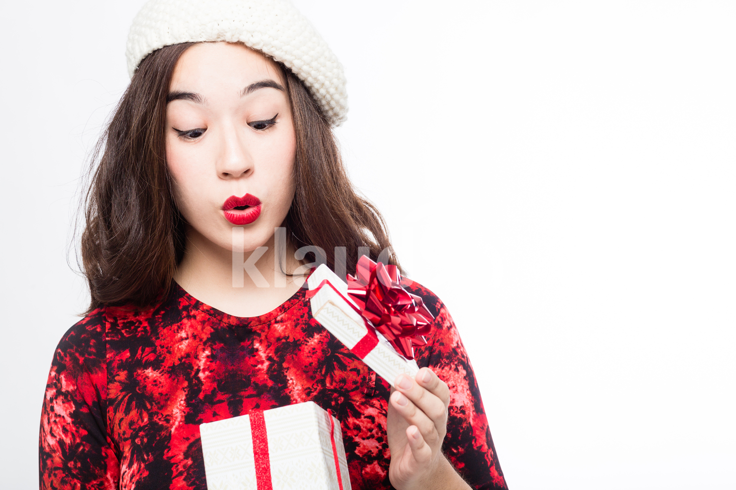 Woman Looking through Her Small Christmas Gift