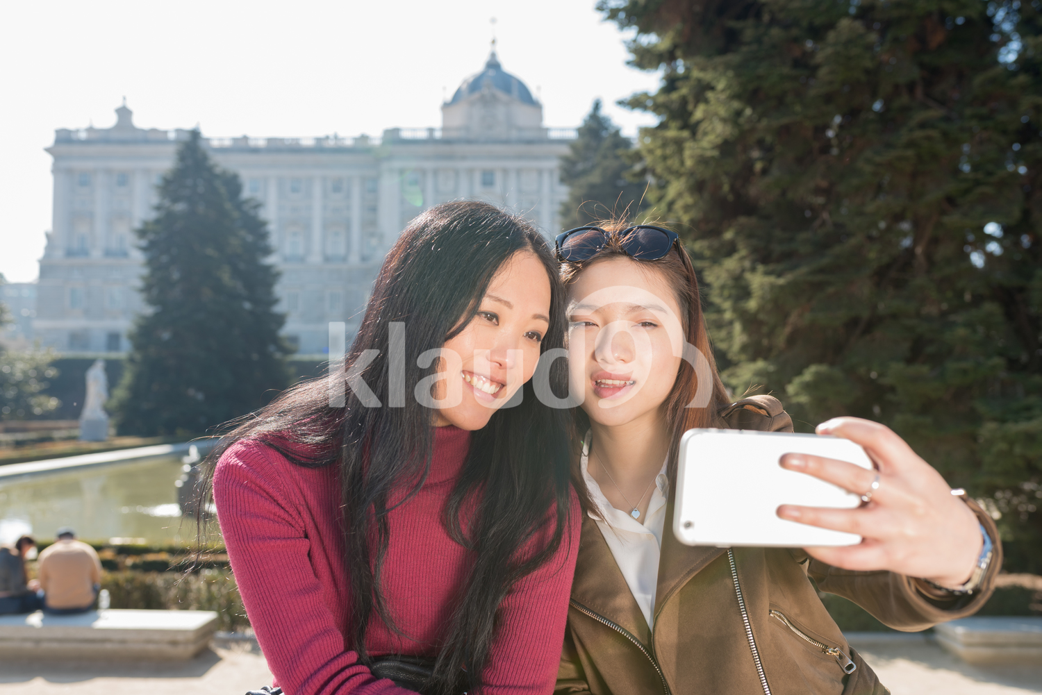 Japanese and Chinese women taking a selfie