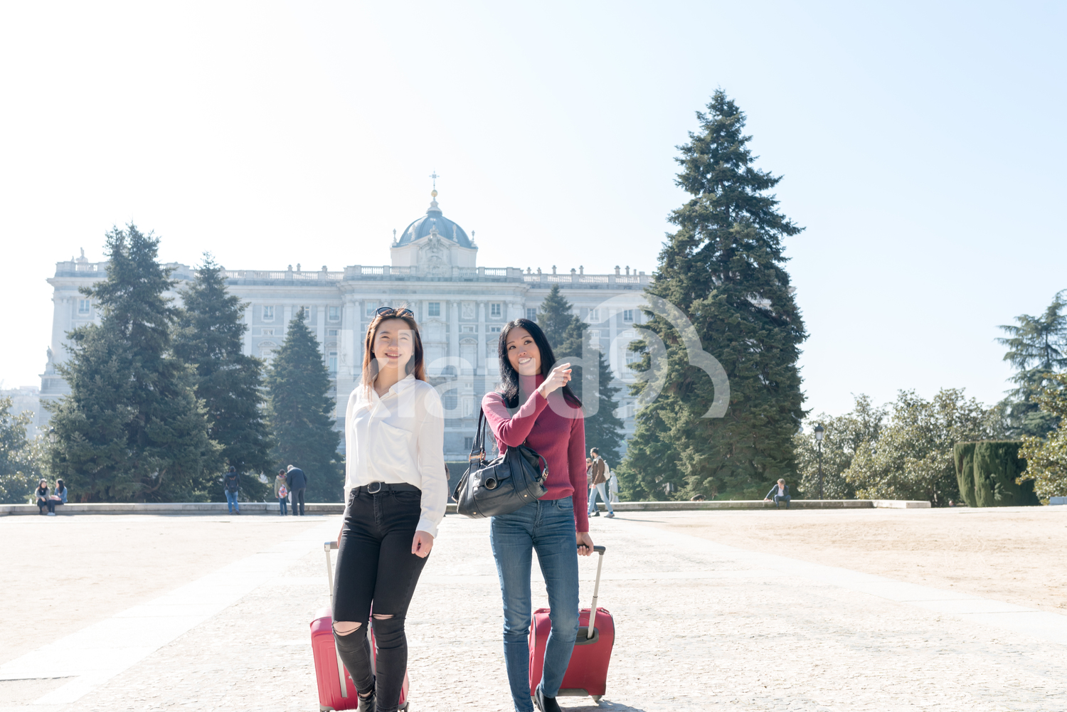 Happy Asian women with their luggage