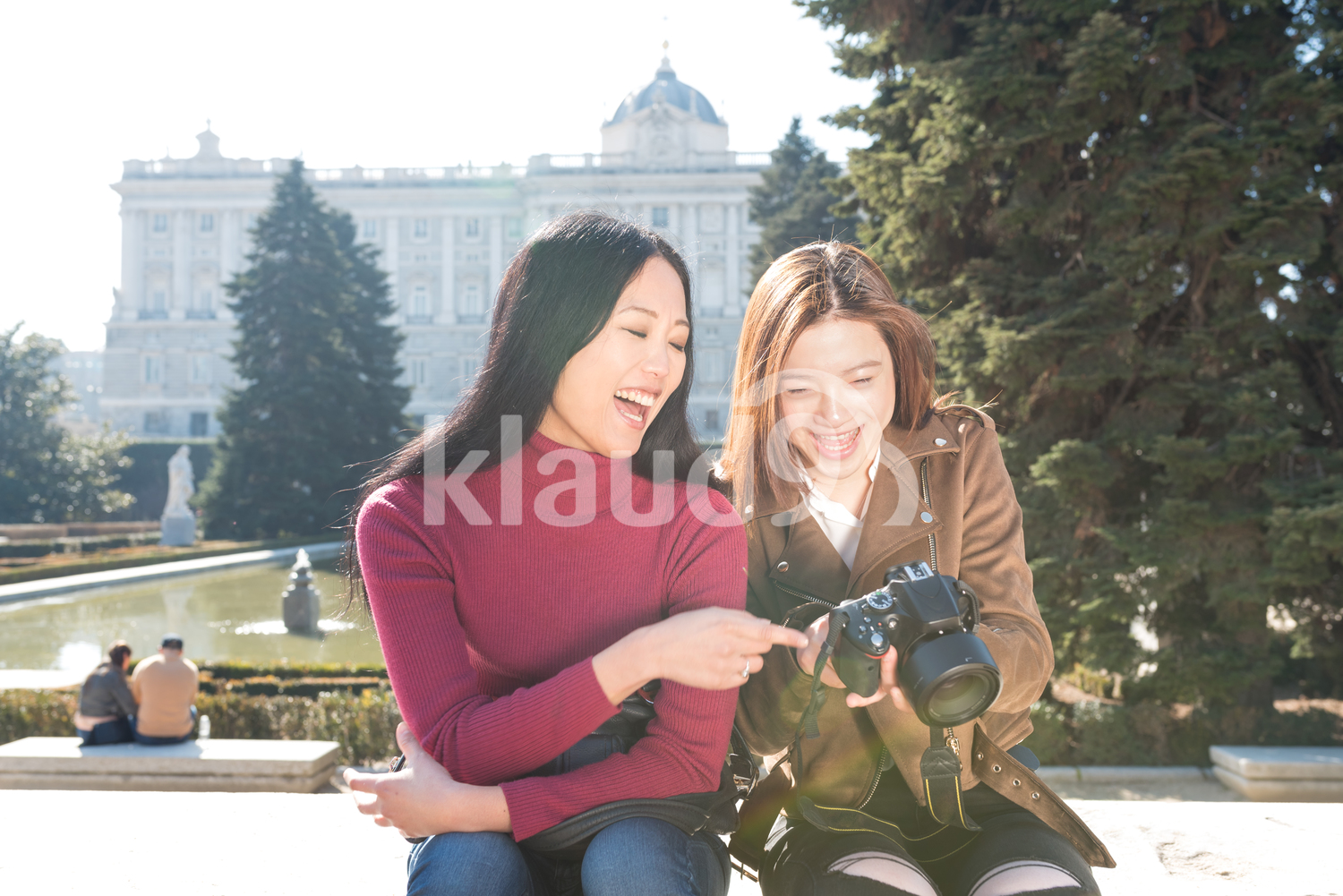 Asian women browsing photos on the camera