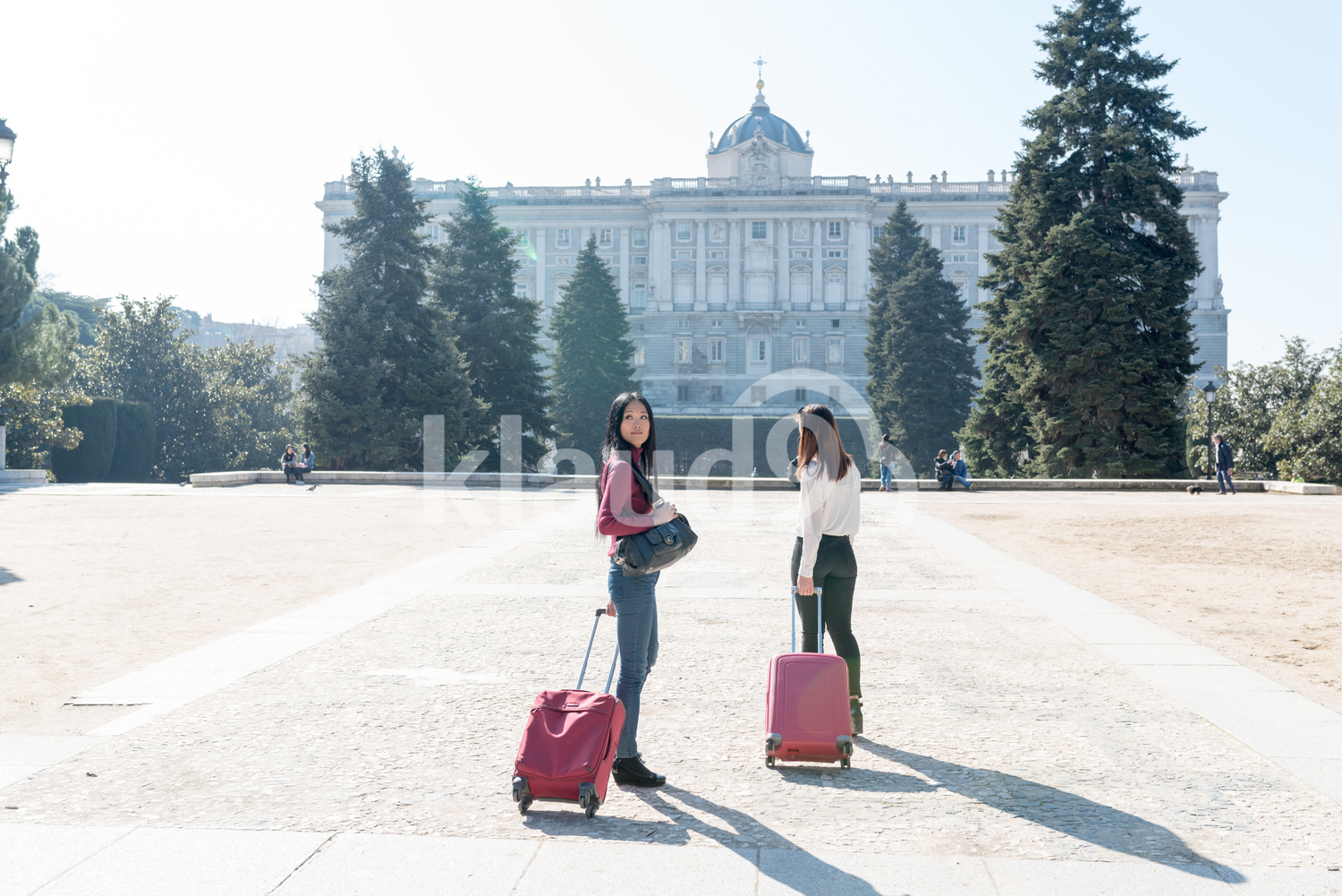 Asian women with suitcases in Madrid