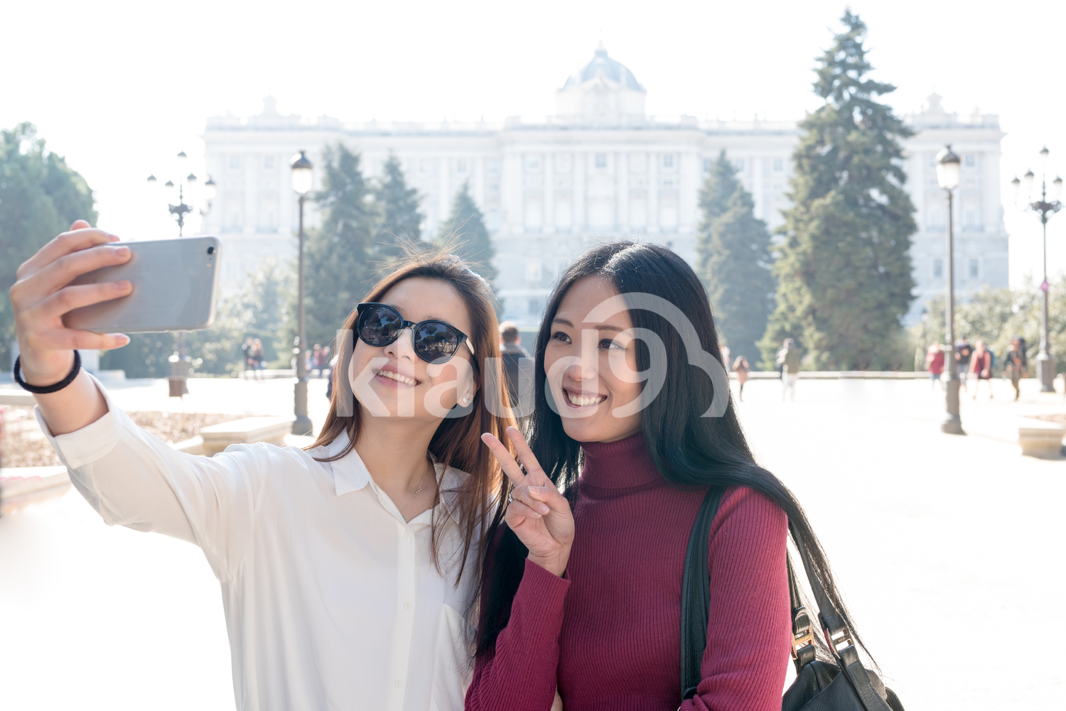 Happy Asian women doing tourism in Madrid