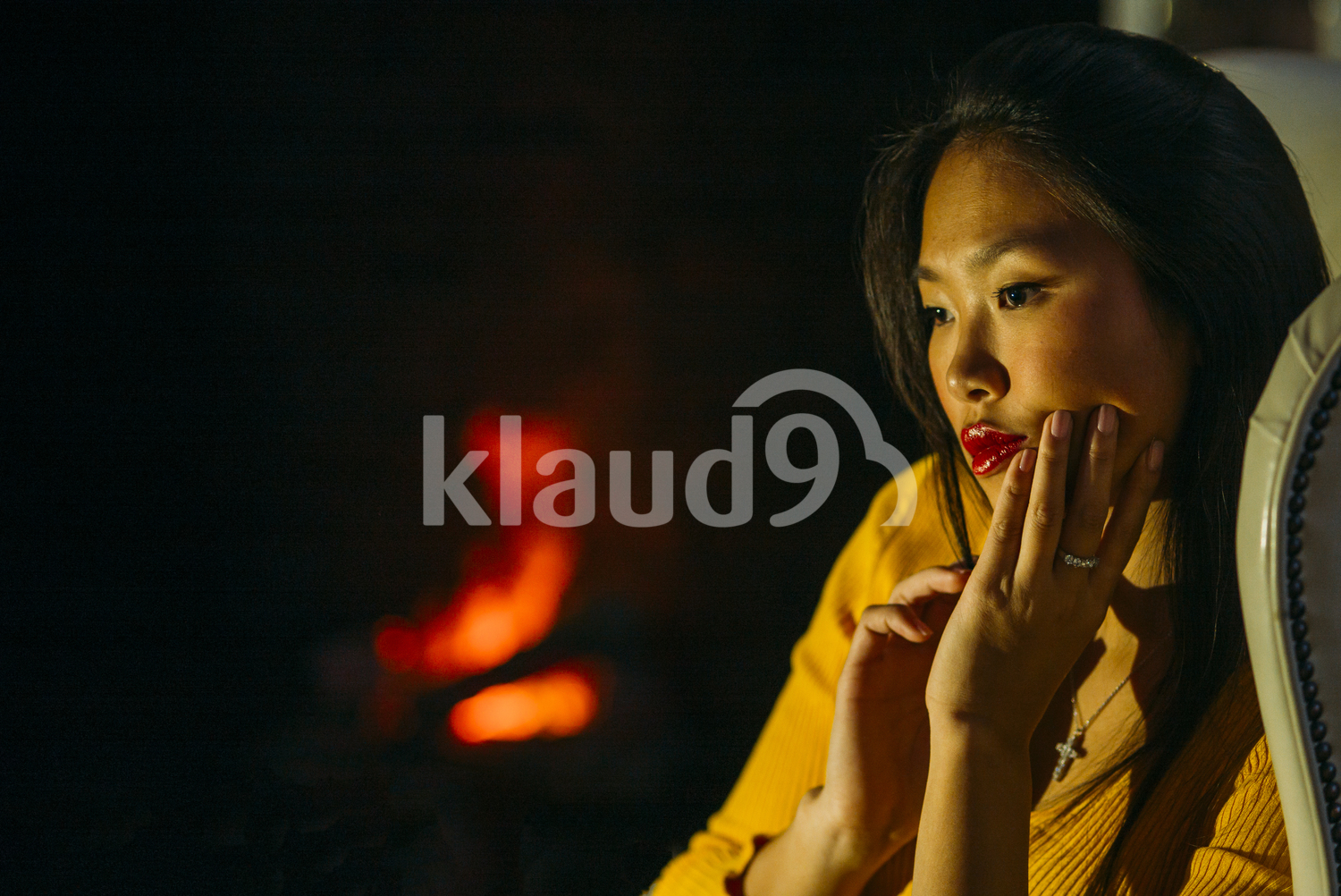 Sexy Chinese woman by the fireplace