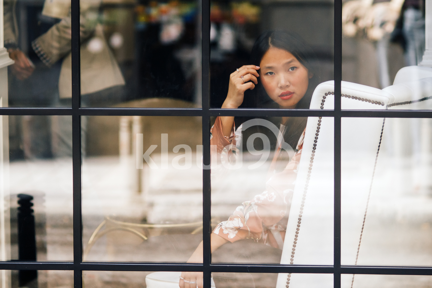 Pretty long Hair Chinese woman sitting in a cafe
