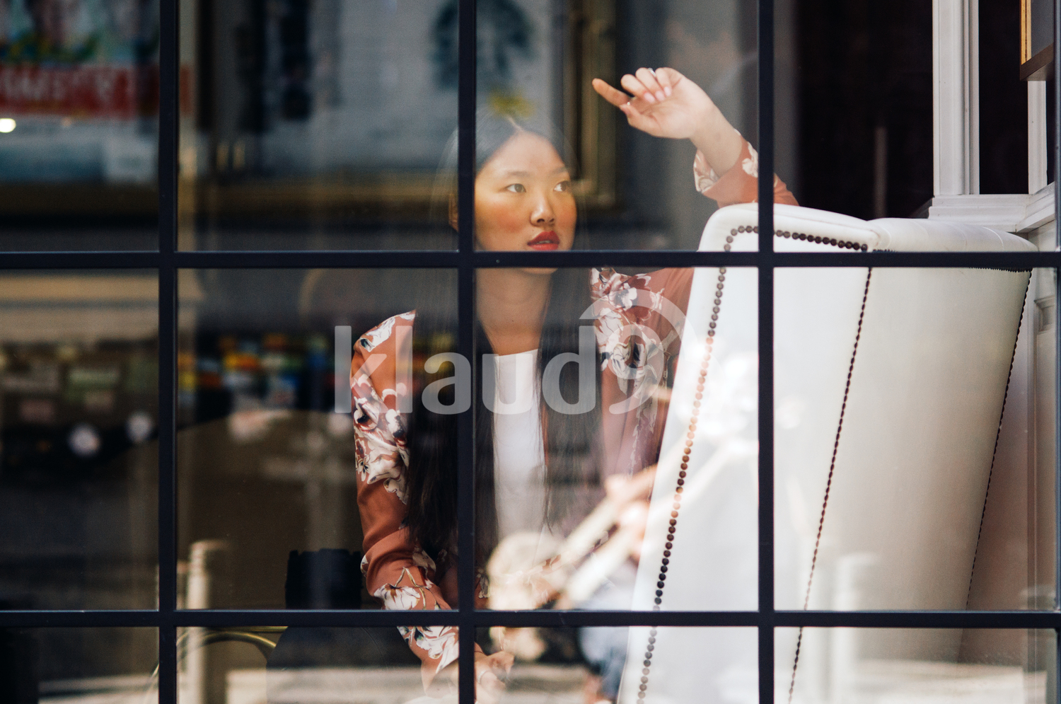 Chinese woman look away through a glass window