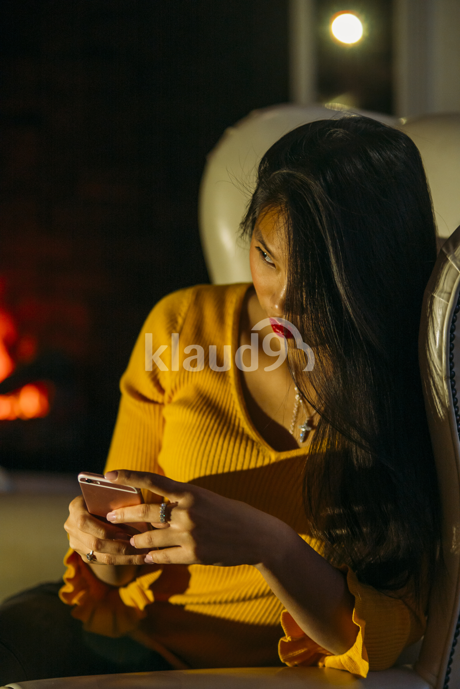 Chinese woman texting on her smartphone