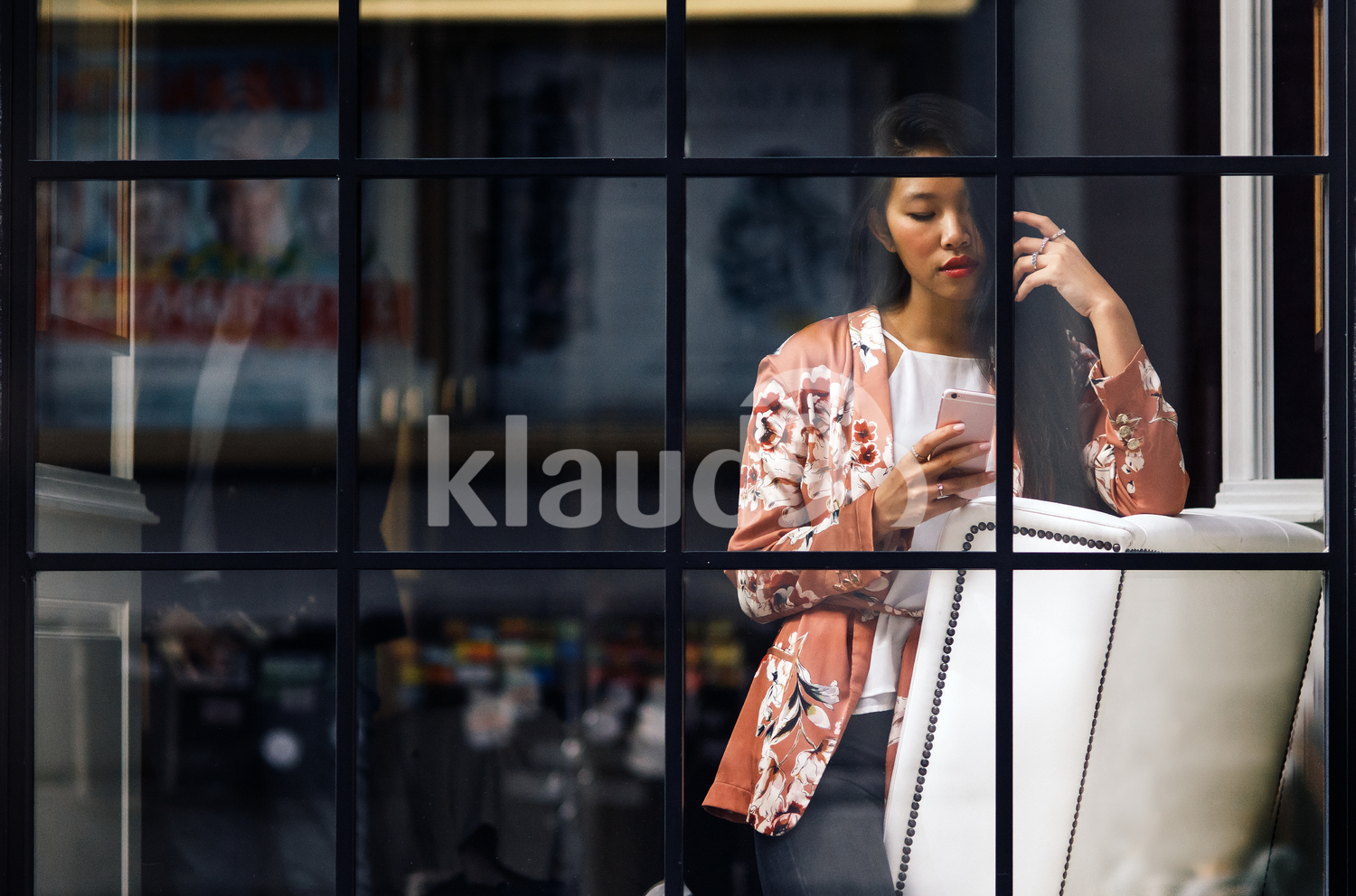 Long hair Chinese woman on her mobile