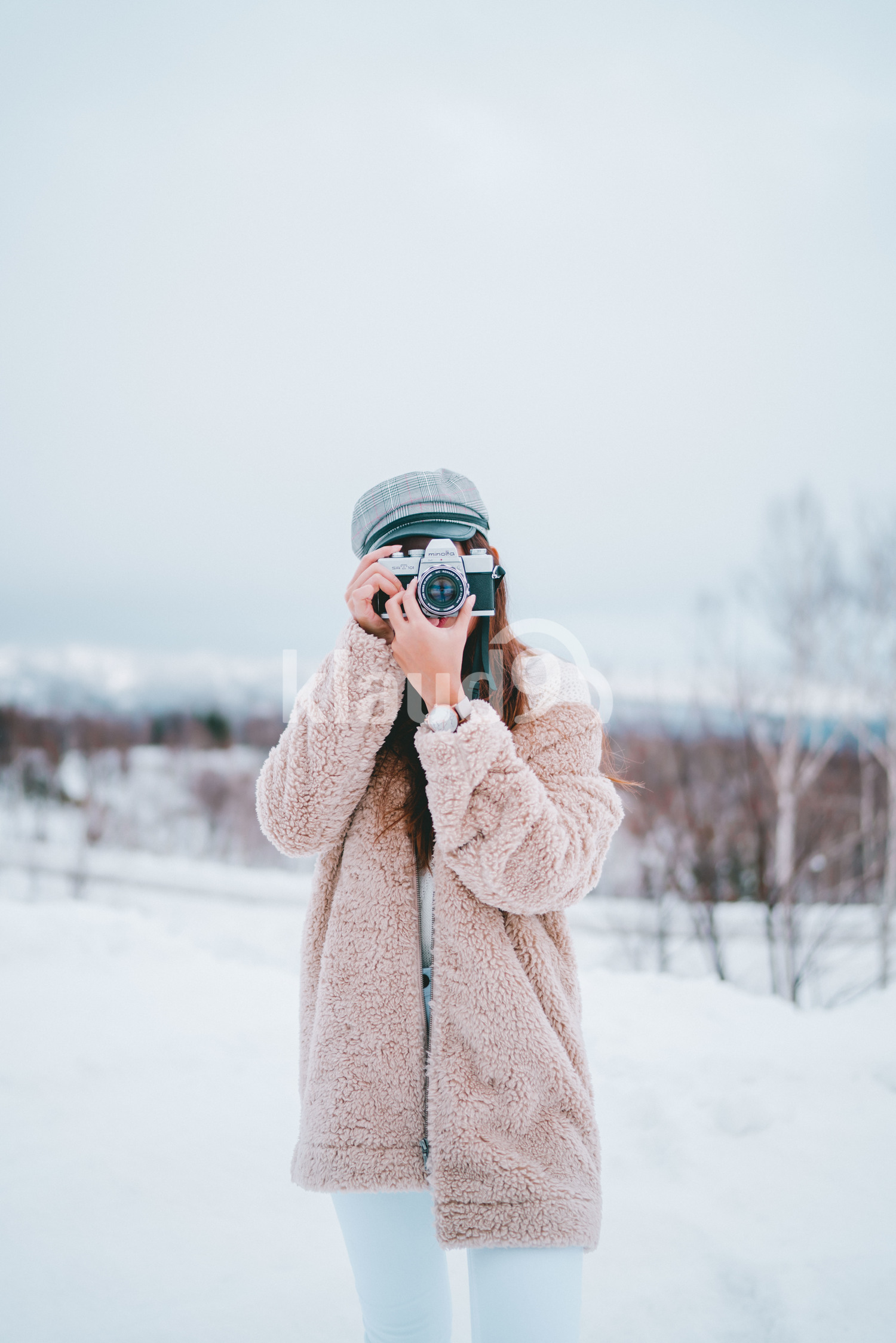 Asian woman with a camera