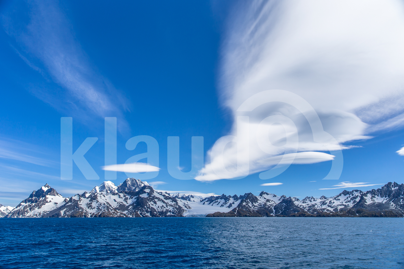 Antarctica high altitude mountains and clouds